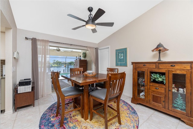 4142 Reif Ct, Port Charlotte, FL 33981 - dining room featuring lofted ceiling, ceiling fan, light tile patterned floors, and a water view