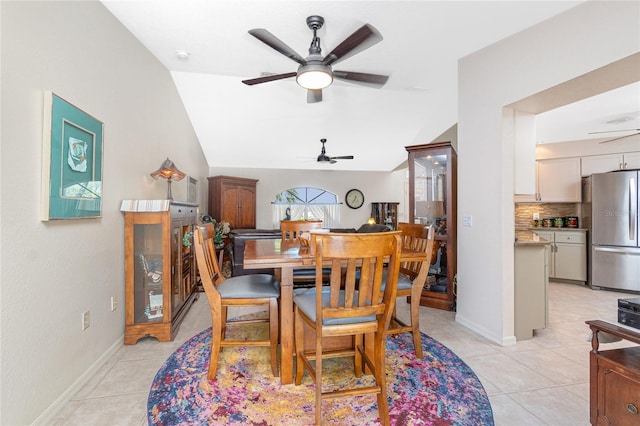 4142 Reif Ct, Port Charlotte, FL 33981 - dining area featuring a ceiling fan, vaulted ceiling, and light tile patterned floors