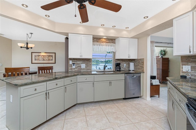 4142 Reif Ct, Port Charlotte, FL 33981 - kitchen featuring stainless steel dishwasher, ceiling fan, a peninsula, decorative backsplash, and white cabinets