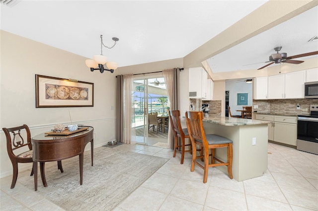 4142 Reif Ct, Port Charlotte, FL 33981 - kitchen featuring stainless steel appliances, tasteful backsplash, light stone counters, and white cabinets