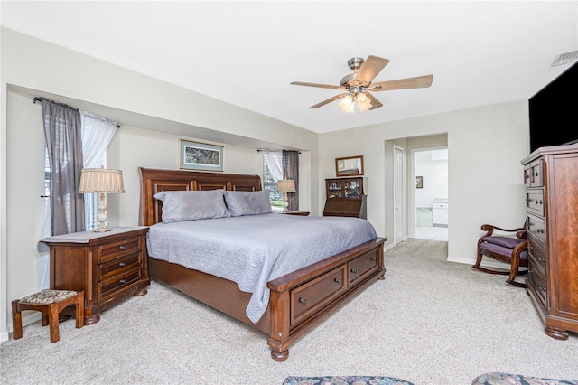 4142 Reif Ct, Port Charlotte, FL 33981 - bedroom featuring light colored carpet, ensuite bath, and a ceiling fan