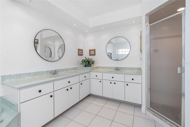 4142 Reif Ct, Port Charlotte, FL 33981 - full bathroom featuring double vanity, a stall shower, tile patterned flooring, and recessed lighting