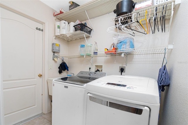 4142 Reif Ct, Port Charlotte, FL 33981 - laundry room with washer and clothes dryer and light tile patterned flooring
