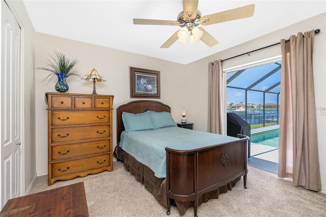4142 Reif Ct, Port Charlotte, FL 33981 - bedroom featuring access to outside, light colored carpet, a sunroom, and a ceiling fan