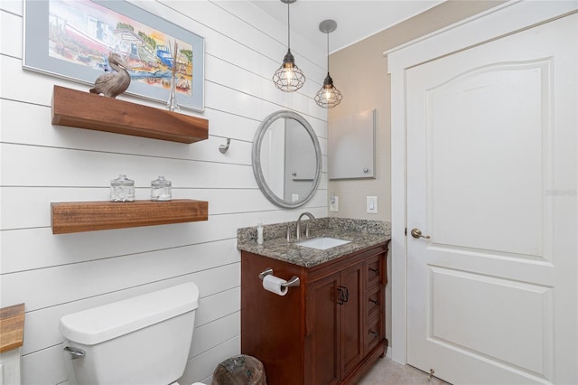 4142 Reif Ct, Port Charlotte, FL 33981 - bathroom featuring vanity and wooden walls