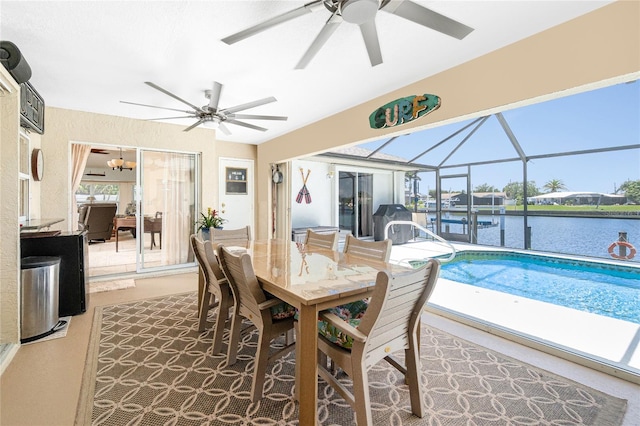4142 Reif Ct, Port Charlotte, FL 33981 - dining space featuring ceiling fan, a sunroom, and a water view