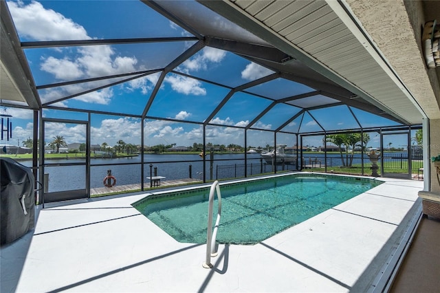 4142 Reif Ct, Port Charlotte, FL 33981 - swimming pool with a patio, a water view, and glass enclosure