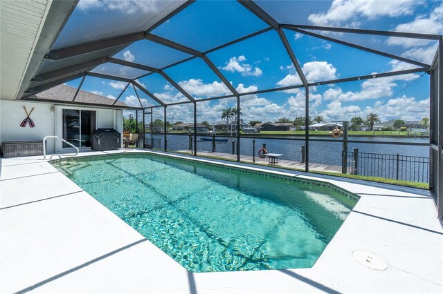 4142 Reif Ct, Port Charlotte, FL 33981 - outdoor pool featuring a water view, a patio, and glass enclosure