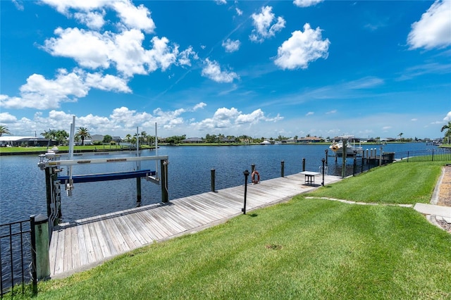 4142 Reif Ct, Port Charlotte, FL 33981 - dock area featuring a lawn, a water view, and boat lift