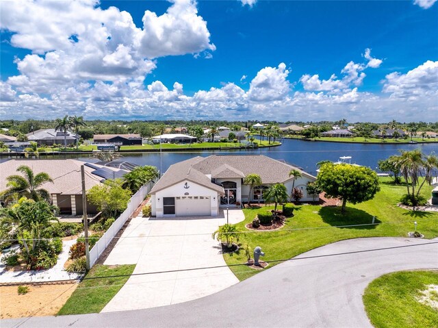 4142 Reif Ct, Port Charlotte, FL 33981 - view of front facade with a water view, concrete driveway, a residential view, and a front lawn