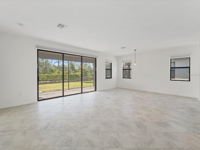 2161 Gardenia Ave, Port Charlotte, FL 33953 - empty room featuring light tile patterned floors and a smoke detector