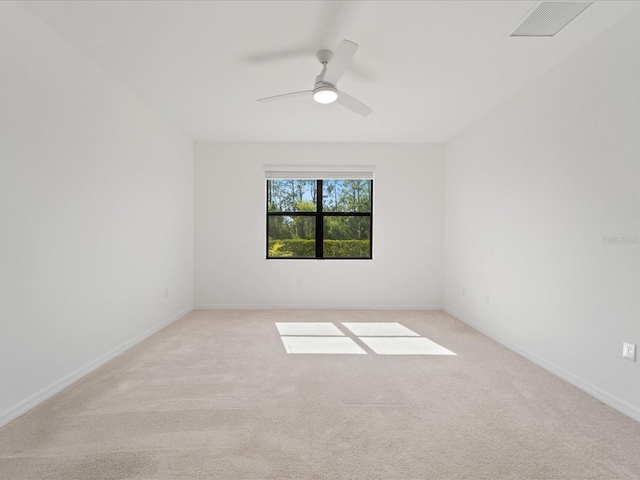 2161 Gardenia Ave, Port Charlotte, FL 33953 - empty room with light colored carpet and a ceiling fan