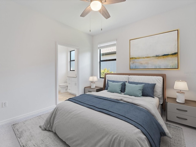 2161 Gardenia Ave, Port Charlotte, FL 33953 - carpeted bedroom with connected bathroom and ceiling fan