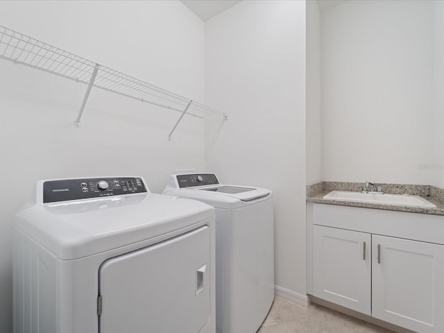 2161 Gardenia Ave, Port Charlotte, FL 33953 - laundry area featuring washing machine and clothes dryer and cabinet space