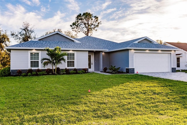 627 SE 22nd Ter, Cape Coral, FL 33990 - ranch-style house featuring an attached garage, a front lawn, a shingled roof, and decorative driveway