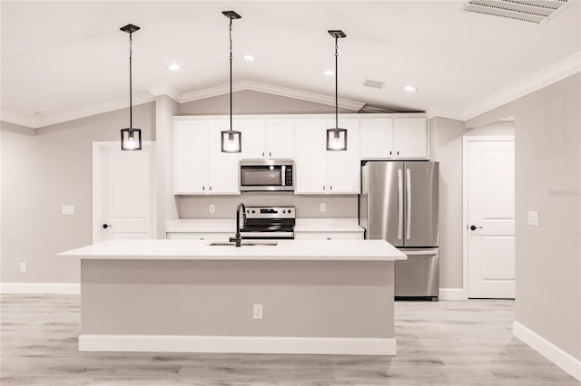 627 SE 22nd Ter, Cape Coral, FL 33990 - kitchen with appliances with stainless steel finishes, vaulted ceiling, crown molding, a kitchen island with sink, and light countertops