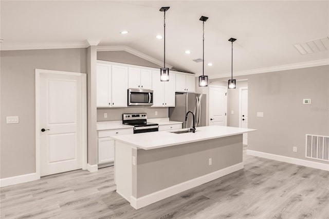 627 SE 22nd Ter, Cape Coral, FL 33990 - kitchen featuring stainless steel appliances, an island with sink, white cabinets, ornamental molding, and light wood-type flooring