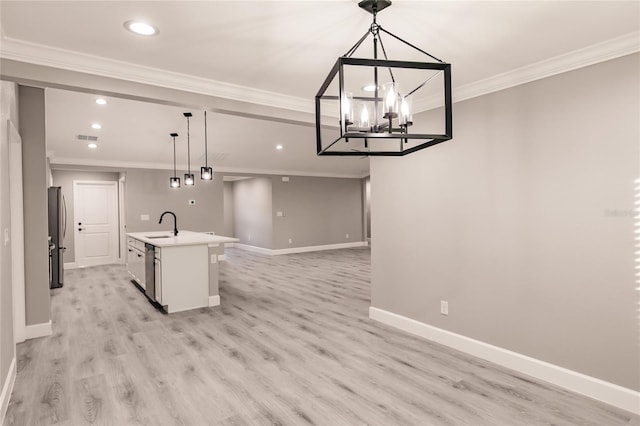 627 SE 22nd Ter, Cape Coral, FL 33990 - kitchen featuring freestanding refrigerator, recessed lighting, ornamental molding, an island with sink, and open floor plan