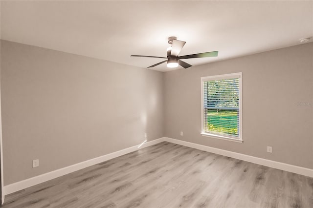 627 SE 22nd Ter, Cape Coral, FL 33990 - spare room featuring a ceiling fan, light wood finished floors, and a smoke detector