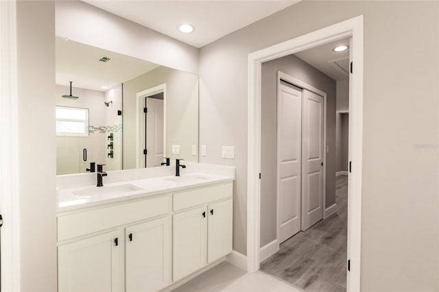 627 SE 22nd Ter, Cape Coral, FL 33990 - bathroom with a shower stall and double vanity