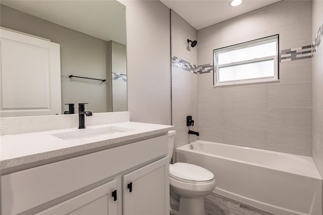 627 SE 22nd Ter, Cape Coral, FL 33990 - full bathroom with vanity, bathing tub / shower combination, and wood finished floors