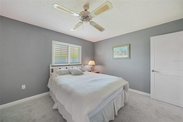 1915 Pebble Beach Ct, Venice, FL 34293 - bedroom featuring light carpet, a textured ceiling, and ceiling fan