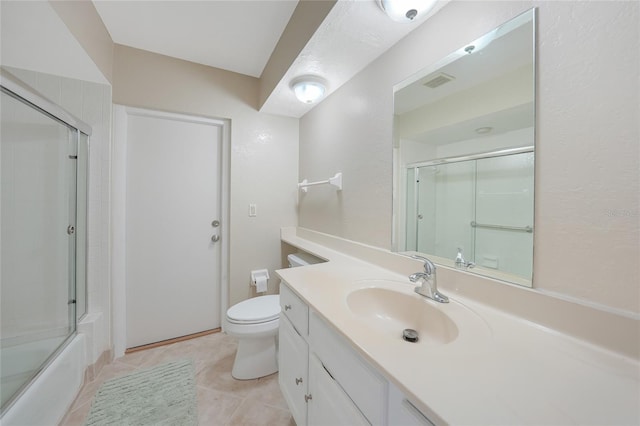 1915 Pebble Beach Ct, Venice, FL 34293 - bathroom with vanity, tile patterned floors, and bath / shower combo with glass door