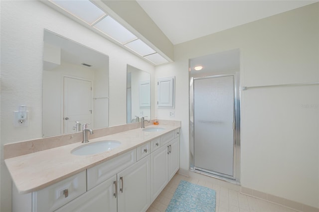 1915 Pebble Beach Ct, Venice, FL 34293 - full bath featuring double vanity, a shower stall, and tile patterned flooring