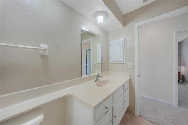 1915 Pebble Beach Ct, Venice, FL 34293 - bathroom featuring vanity and a textured wall