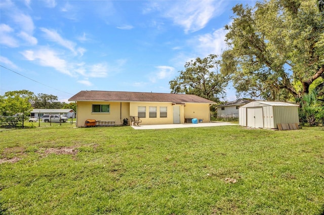 1478 Harmony Dr, Port Charlotte, FL 33952 - rear view of house with a storage unit, a patio area, and stucco siding