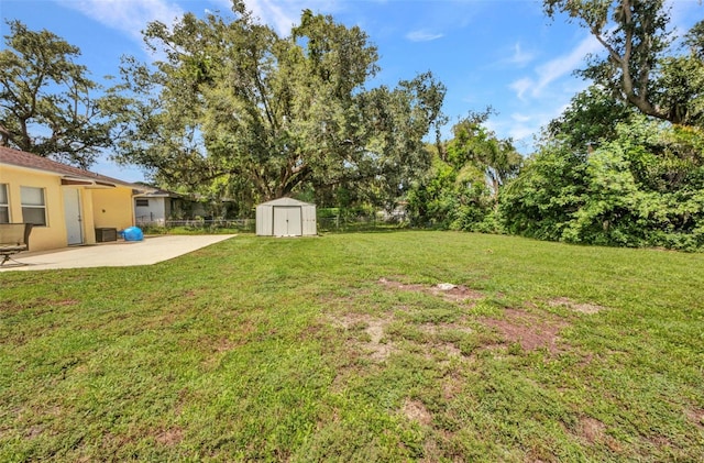 1478 Harmony Dr, Port Charlotte, FL 33952 - fenced backyard with a patio and a storage unit