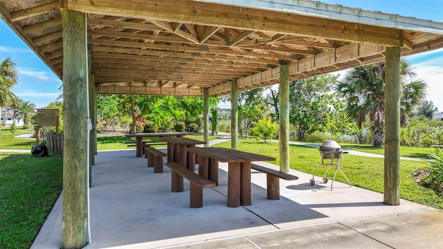 9155 Agate St, Port Charlotte, FL 33981 - surrounding community with a lawn and a patio area