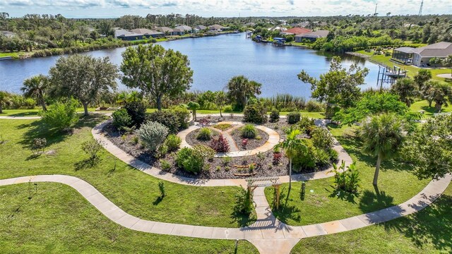 9155 Agate St, Port Charlotte, FL 33981 - aerial perspective of suburban area with a large body of water and a tree filled landscape