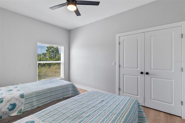 9155 Agate St, Port Charlotte, FL 33981 - bedroom with light wood-style flooring, a closet, and ceiling fan