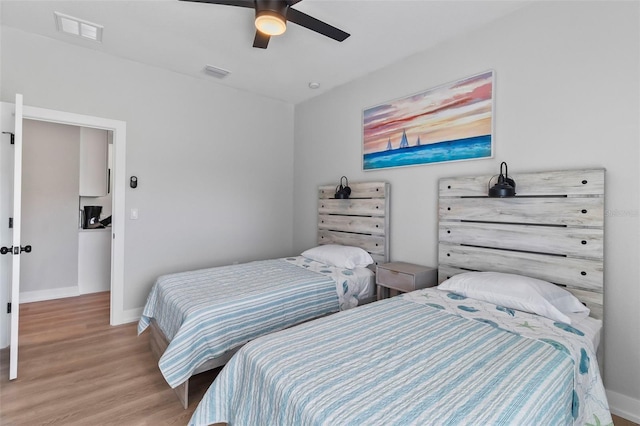 9155 Agate St, Port Charlotte, FL 33981 - bedroom with wood finished floors and a ceiling fan