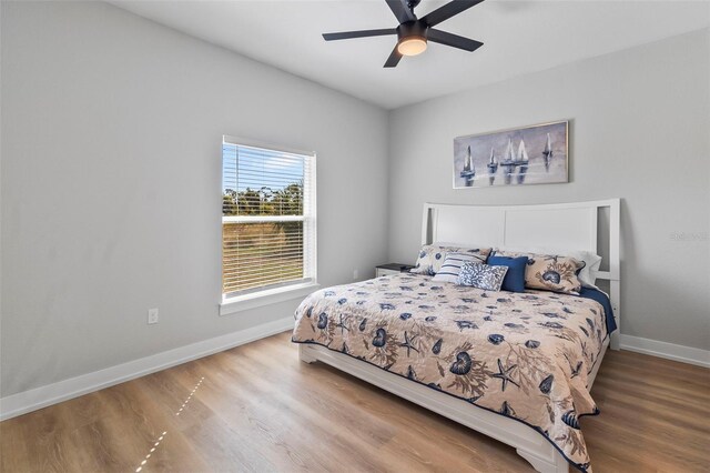 9155 Agate St, Port Charlotte, FL 33981 - bedroom with wood finished floors and a ceiling fan