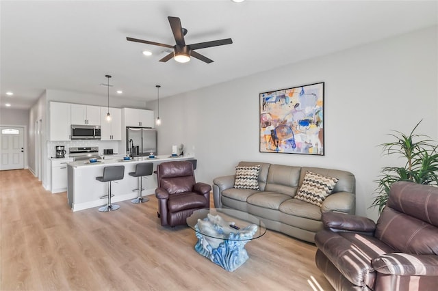 9155 Agate St, Port Charlotte, FL 33981 - living area with ceiling fan, recessed lighting, and light wood finished floors