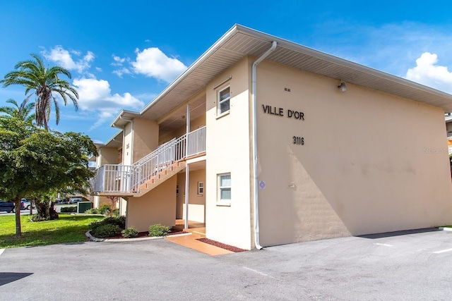 3116 Harbor Blvd Unit 3B, Port Charlotte, FL 33952 - view of building exterior featuring stairway
