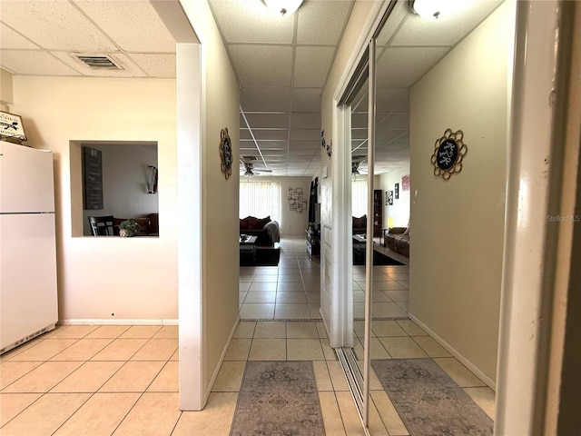 3116 Harbor Blvd Unit 3B, Port Charlotte, FL 33952 - hallway with a drop ceiling and light tile patterned floors