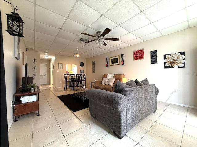 3116 Harbor Blvd Unit 3B, Port Charlotte, FL 33952 - living area with light tile patterned floors, ceiling fan, and a drop ceiling