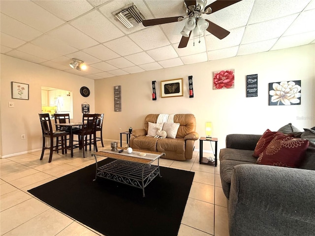 3116 Harbor Blvd Unit 3B, Port Charlotte, FL 33952 - living room featuring light tile patterned floors, a paneled ceiling, and ceiling fan