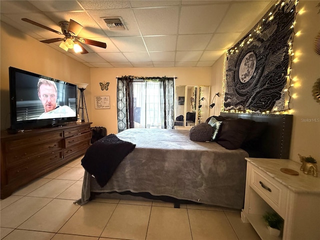 3116 Harbor Blvd Unit 3B, Port Charlotte, FL 33952 - bedroom featuring a drop ceiling, light tile patterned floors, and ceiling fan