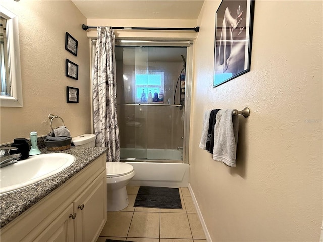 3116 Harbor Blvd Unit 3B, Port Charlotte, FL 33952 - bathroom featuring tile patterned floors, vanity, and enclosed tub / shower combo