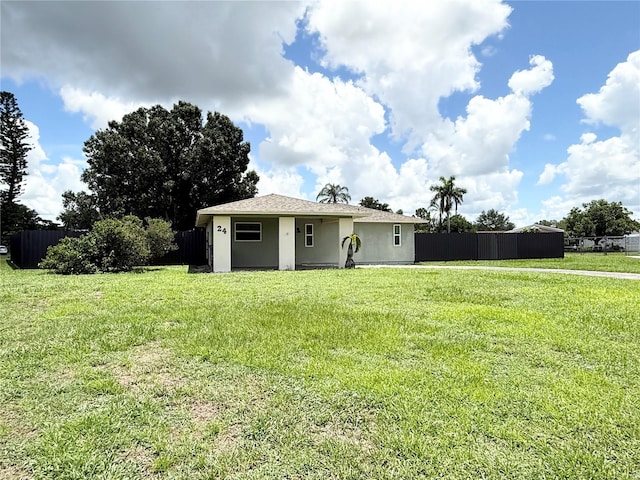 24 Charwood Cir, Lehigh Acres, FL 33936 - view of front of house with stucco siding