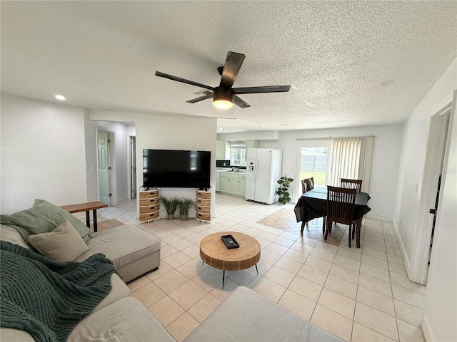 24 Charwood Cir, Lehigh Acres, FL 33936 - living area with a textured ceiling, light tile patterned floors, ceiling fan, and recessed lighting
