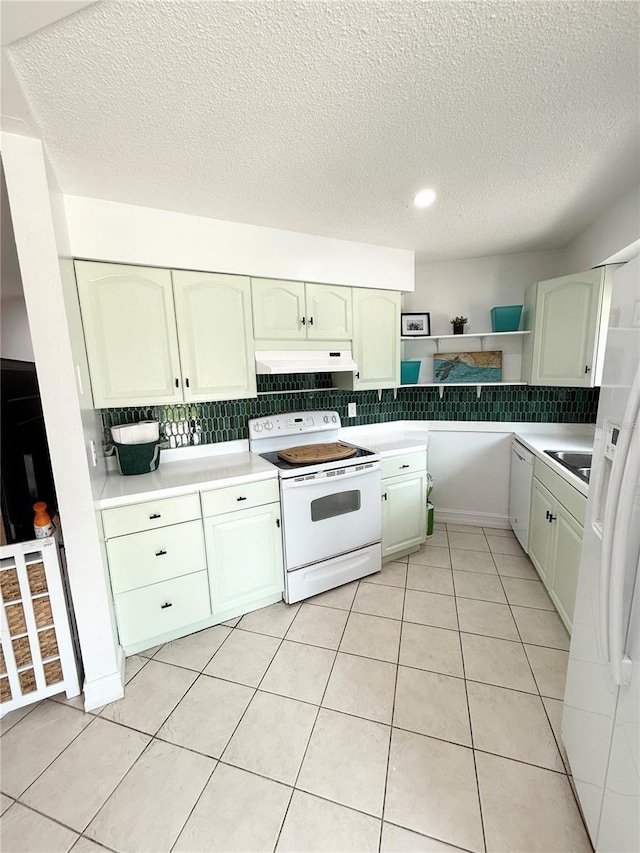 24 Charwood Cir, Lehigh Acres, FL 33936 - kitchen featuring white appliances, open shelves, backsplash, a textured ceiling, and custom exhaust hood