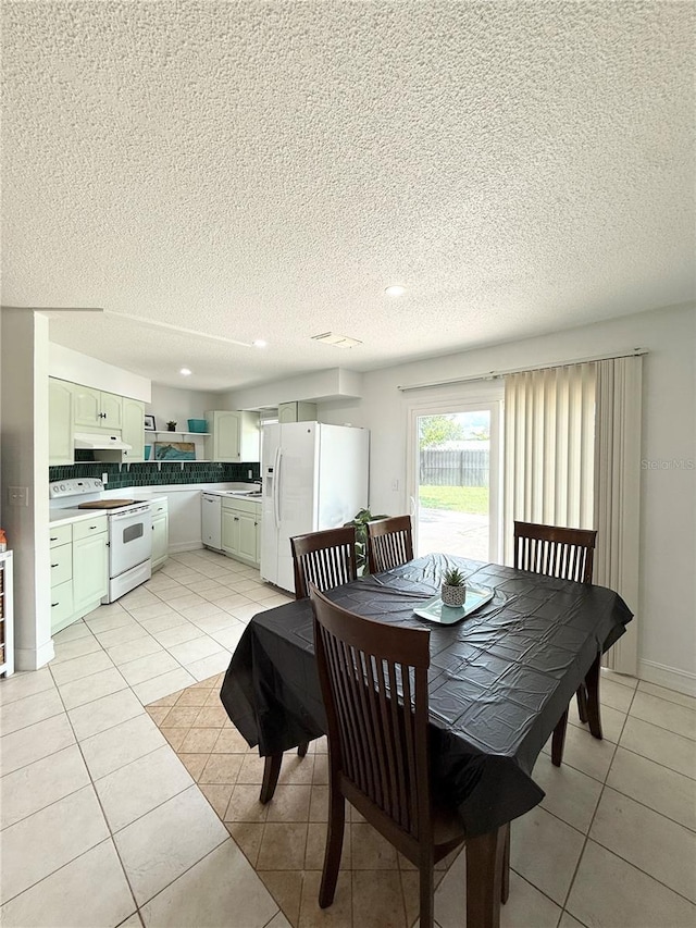 24 Charwood Cir, Lehigh Acres, FL 33936 - dining room featuring light tile patterned floors, a textured ceiling, wine cooler, and recessed lighting