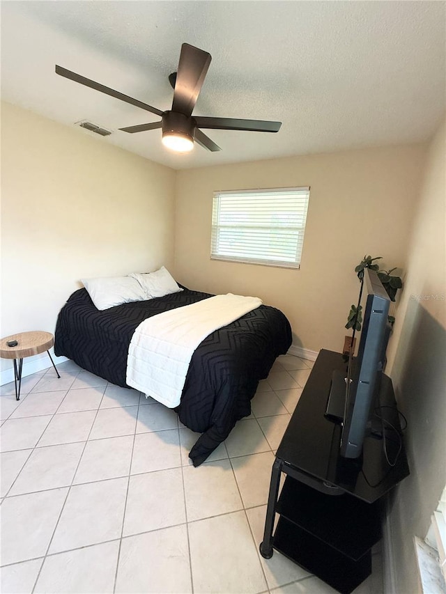 24 Charwood Cir, Lehigh Acres, FL 33936 - bedroom featuring ceiling fan and light tile patterned floors