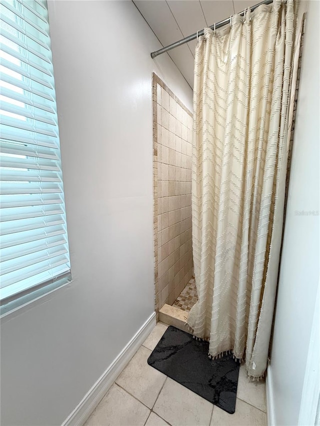 24 Charwood Cir, Lehigh Acres, FL 33936 - bathroom featuring a tile shower and tile patterned flooring