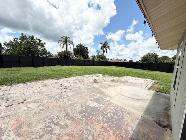 24 Charwood Cir, Lehigh Acres, FL 33936 - fenced backyard featuring a patio area
